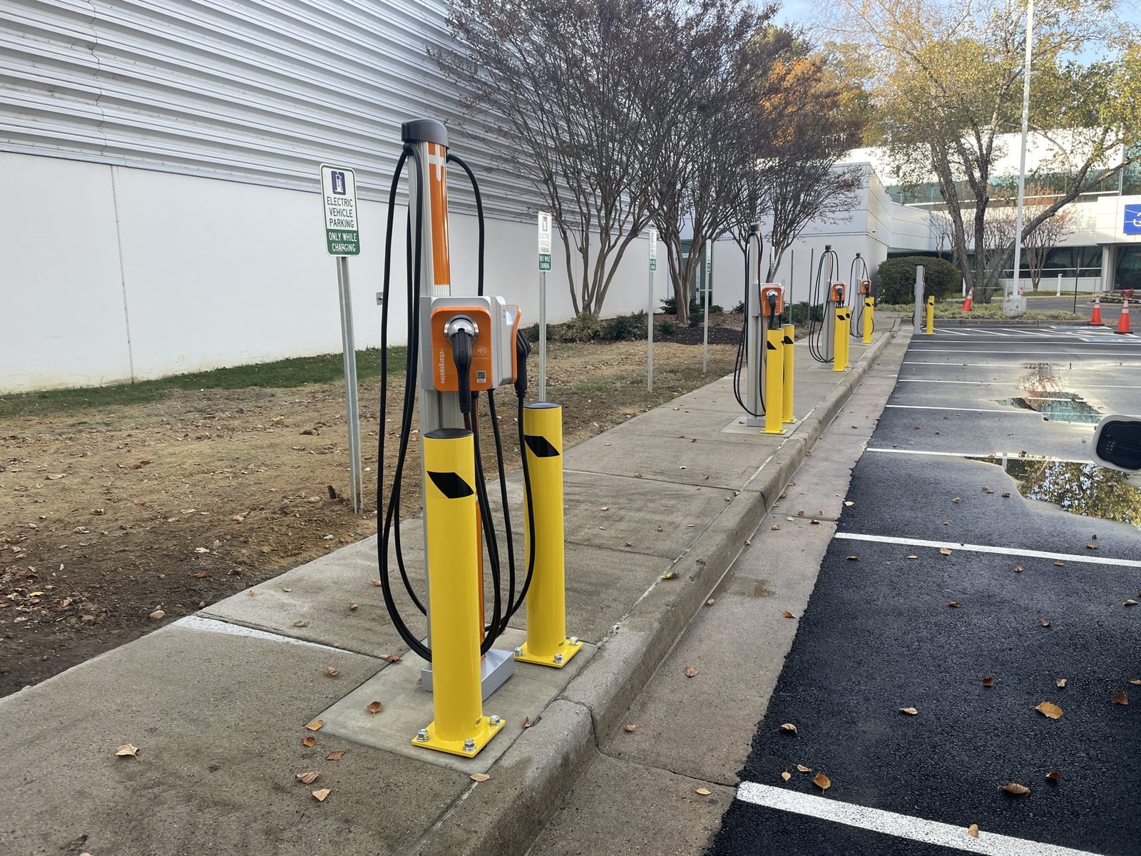 Row of commercial EV charging pedestals installed by GreenKey