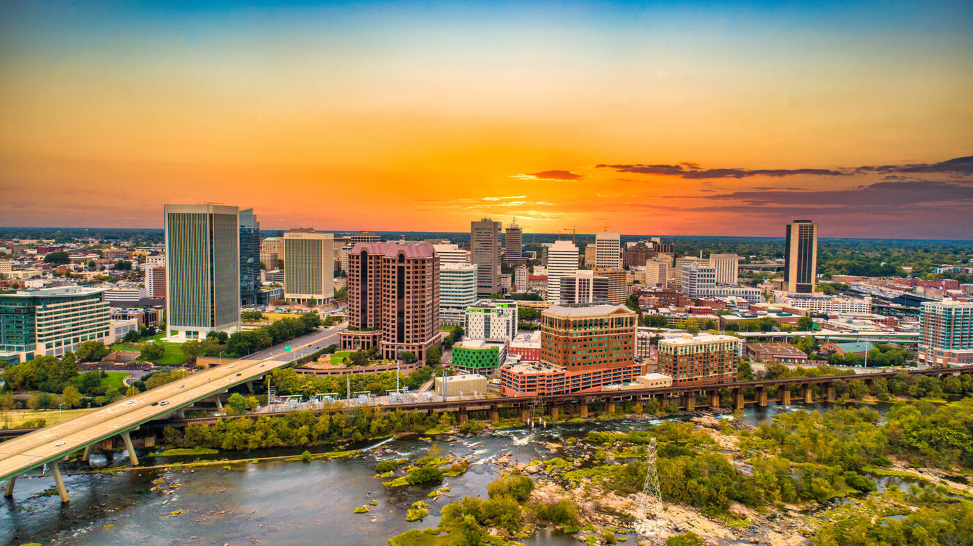Downtown Richmond, VA skyline at sunset over the James River