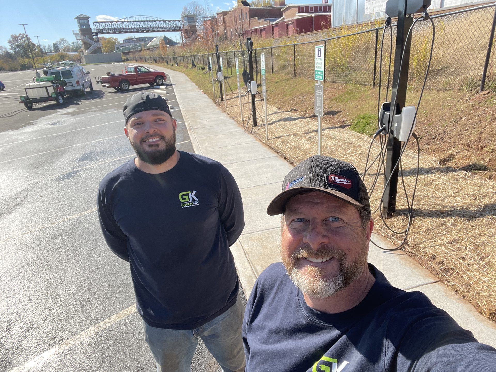 Jonathan and Chase of GreenKey at a completed commercial EV charging installation